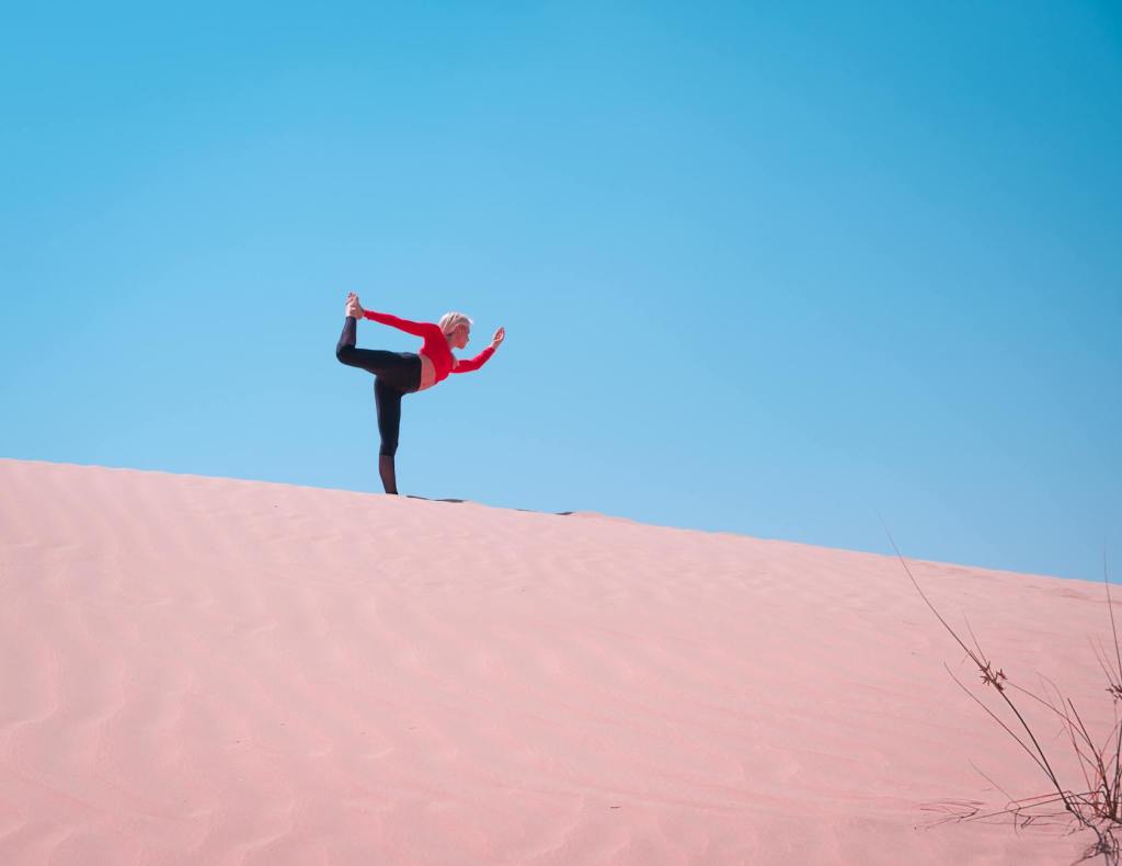 person standing on desert